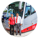 two men standing in front of a bus in Belize